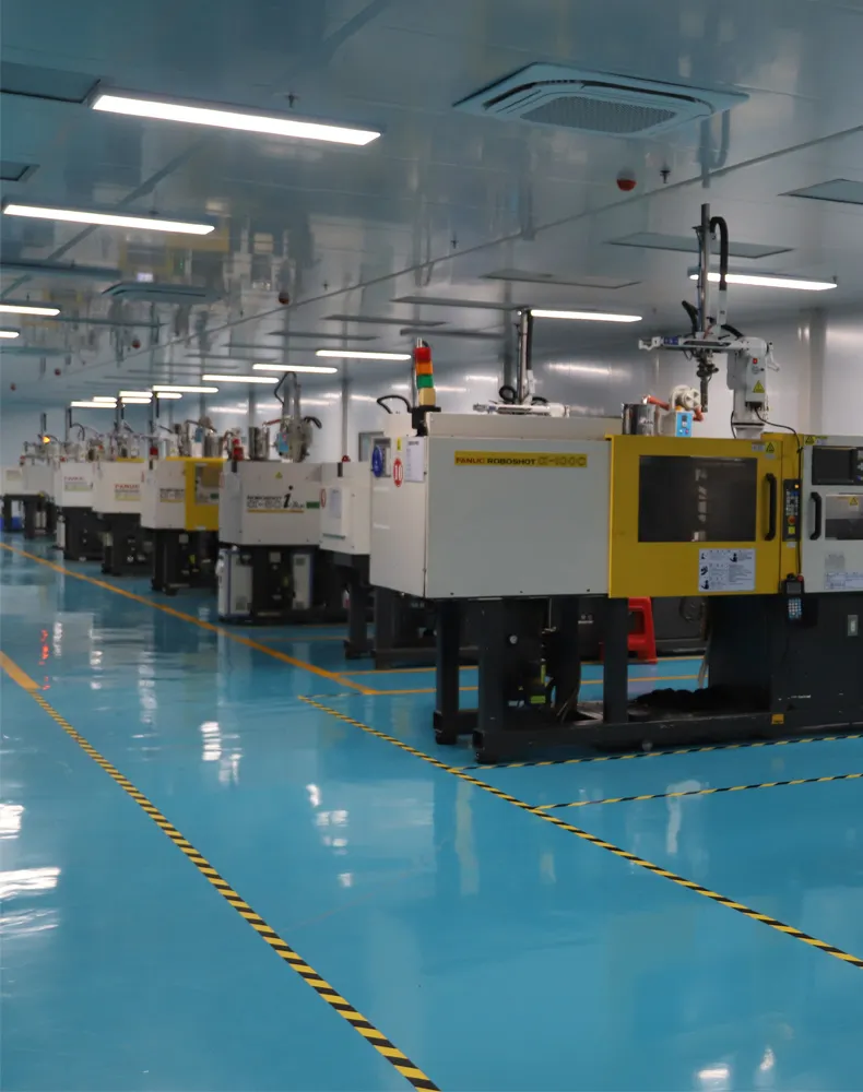 A climate-controlled cleanroom facility featuring a row of high-precision electric injection molding machines on an anti-static blue floor, optimized for medical and optical component production.