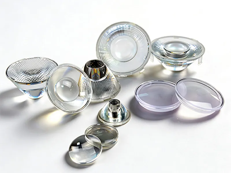 A collection of precision injection molded optical lenses, including TIR lenses, Fresnel lenses, and aspheric lenses in PMMA and PC materials, designed for high-efficiency LED lighting systems.