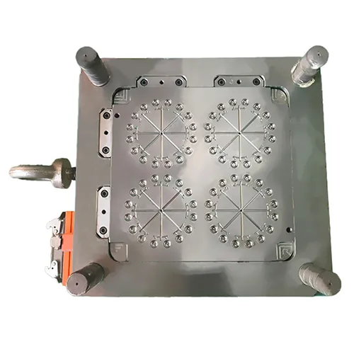 A top view of a precision-machined steel injection mold base, featuring four multi-cavity circular layouts for mass production of small optical components, including guide pillars and polished mold plates.