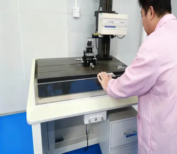 Operating a non-contact optical profilometer to measure surface roughness and contour accuracy of a custom lens element, ensuring sub-micron profile fidelity.
