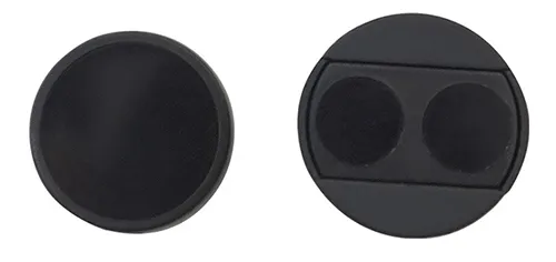 Front and back view of a black circular infrared sensor filter lens, showing a smooth flat front side on the left and a reverse side with a rectangular recess and two circular sensing areas on the right.