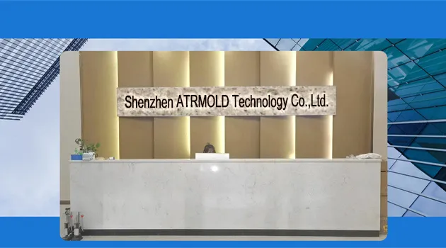 The front reception desk of Shenzhen ATRMOLD Technology Co., Ltd. featuring a white marble counter and a backlit golden wall with the company name sign.