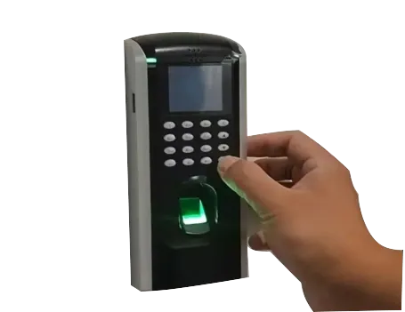 A wall-mounted fingerprint access control terminal with a square display screen, a numeric keypad, and an illuminated green biometric scanner, showing a hand pressing a button.