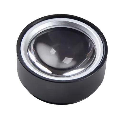 A close-up view of an infrared thermometer optical lens module isolated on a solid white background. The component features a black anodized cylindrical barrel with a silver chamfered retaining ring, housing a thick high-curvature clear optical focusing lens designed to direct infrared radiation onto thermal sensors with minimal distortion and high transmission efficiency.